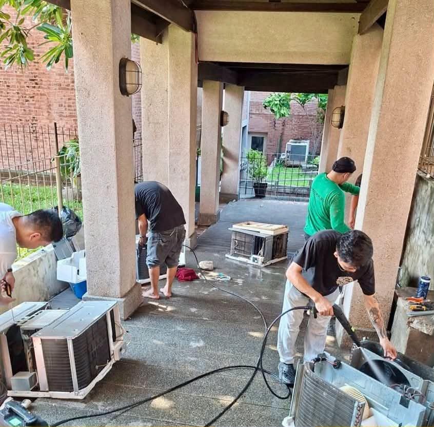 Our technicians cleaning aircon units on site